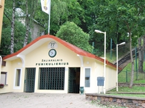 <p style="text-align: justify;">Funicular railway in the Kaunas district of Žaliakalnis is a particularly fine example of the Kaunas government’s attempts to improve the infrastructure of the rapidly expanding city. Among the principal concerns at the time of its construction was a disproportionate distribution of the building activity between the new-town and the Green Hill areas. It has been noticed in the late 1920s that the new-town became a particularly desirable area for new developments. Land and property prices were growing there rapidly too. The Green Hill area, on the other hand, was lacking interest of local investors and developers.  Funicular railway was intended to improve the pedestrians’ communication between the two parts of the city. The first funicular wagon opened its doors in the early 30s and shortly after that, the second wagon was ordered. In 1937 the funicular went one of the major reconstructions; two spacious new passenger wagons replaced the primitive-original once and the rail-tracks were improved. Lithuanian engineer N. Dobkevičius was responsible for designing the new wagons, and a Swiss company ‘Theodor Bell’ produced the chassis. Up until this point the funicular is in working order. The existence of such type of transportation highlights one of Kaunas’ most distinctive topographical traits – hilly urban scenery.</p>
<p style="text-align: justify;"><em>Kristina Rimkutė </em>   </p>